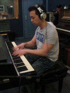 Tien playing Fender Rhodes at a recording session